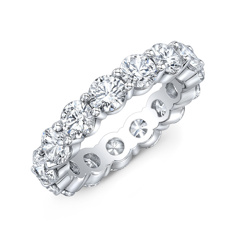 Timeless eternity band featuring round-cut diamonds in a shared prong setting, offering continuous brilliance and classic elegance.