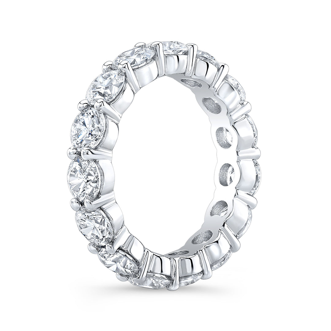 Timeless eternity band featuring round-cut diamonds in a shared prong setting, offering continuous brilliance and classic elegance.