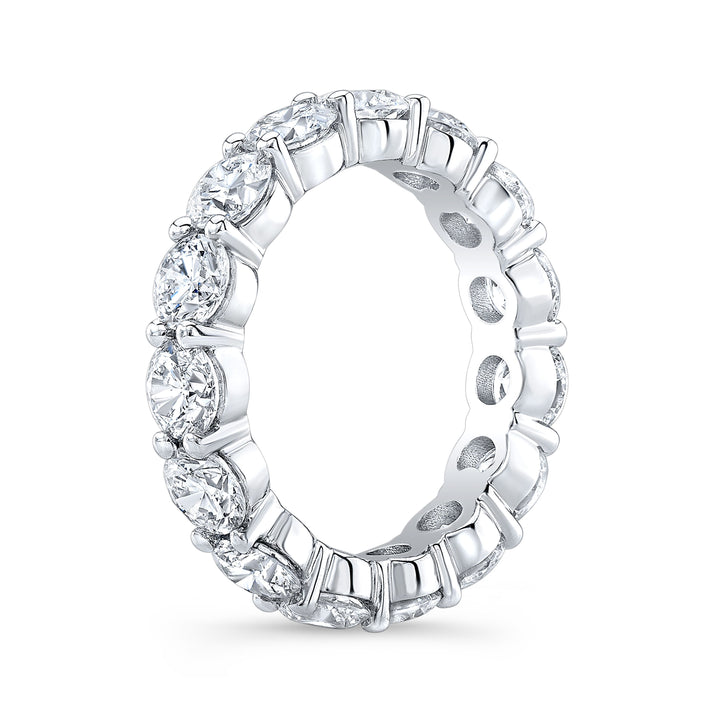 Timeless eternity band featuring round-cut diamonds in a shared prong setting, offering continuous brilliance and classic elegance.