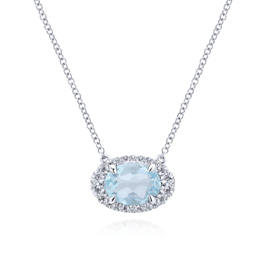 Elegant gemstone and diamond necklace in white gold, featuring a vibrant gemstone centerpiece accented by shimmering diamonds for a timeless and sophisticated look.